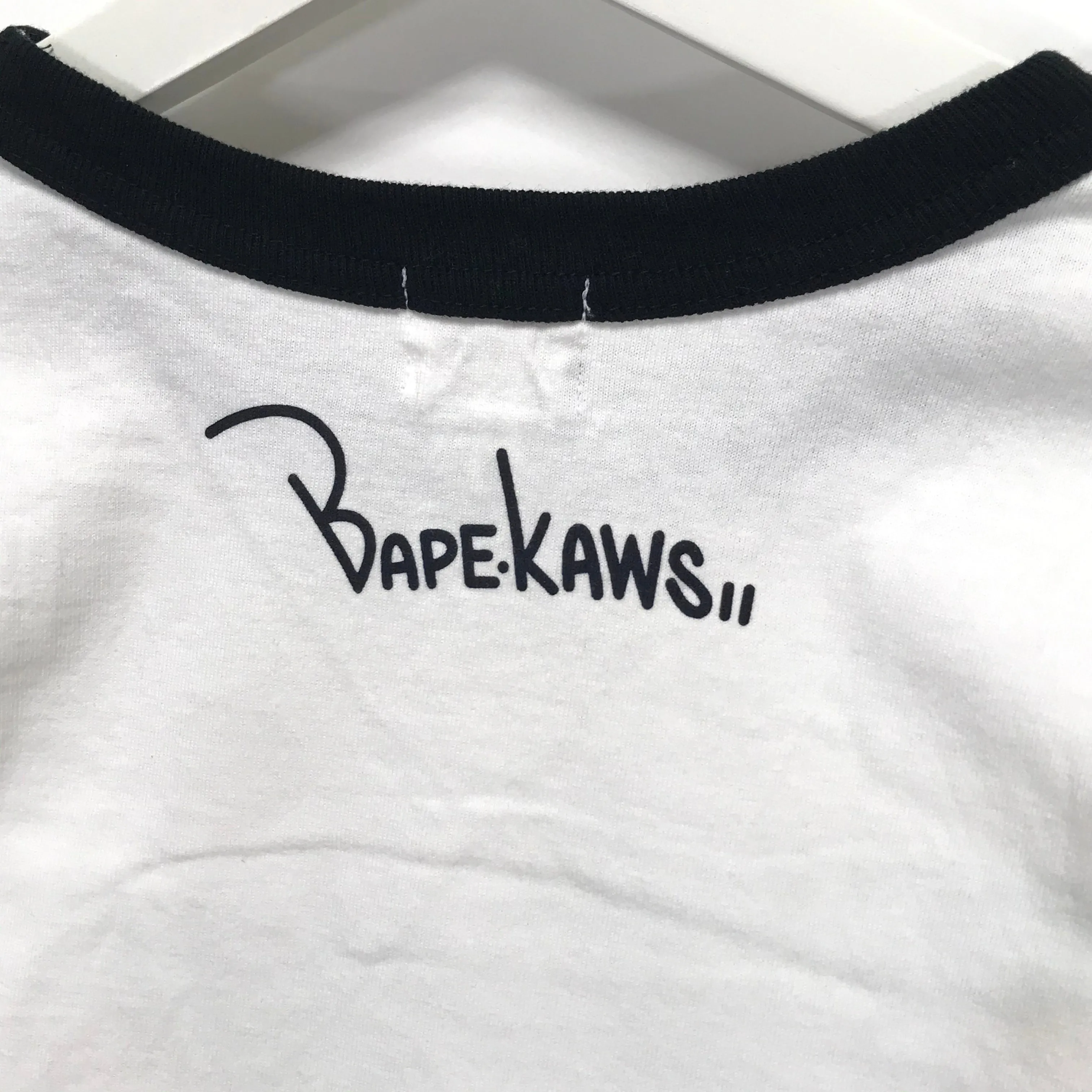 [S] A Bathing Ape Bape x Kaws Logo Ringer L/S Tee White