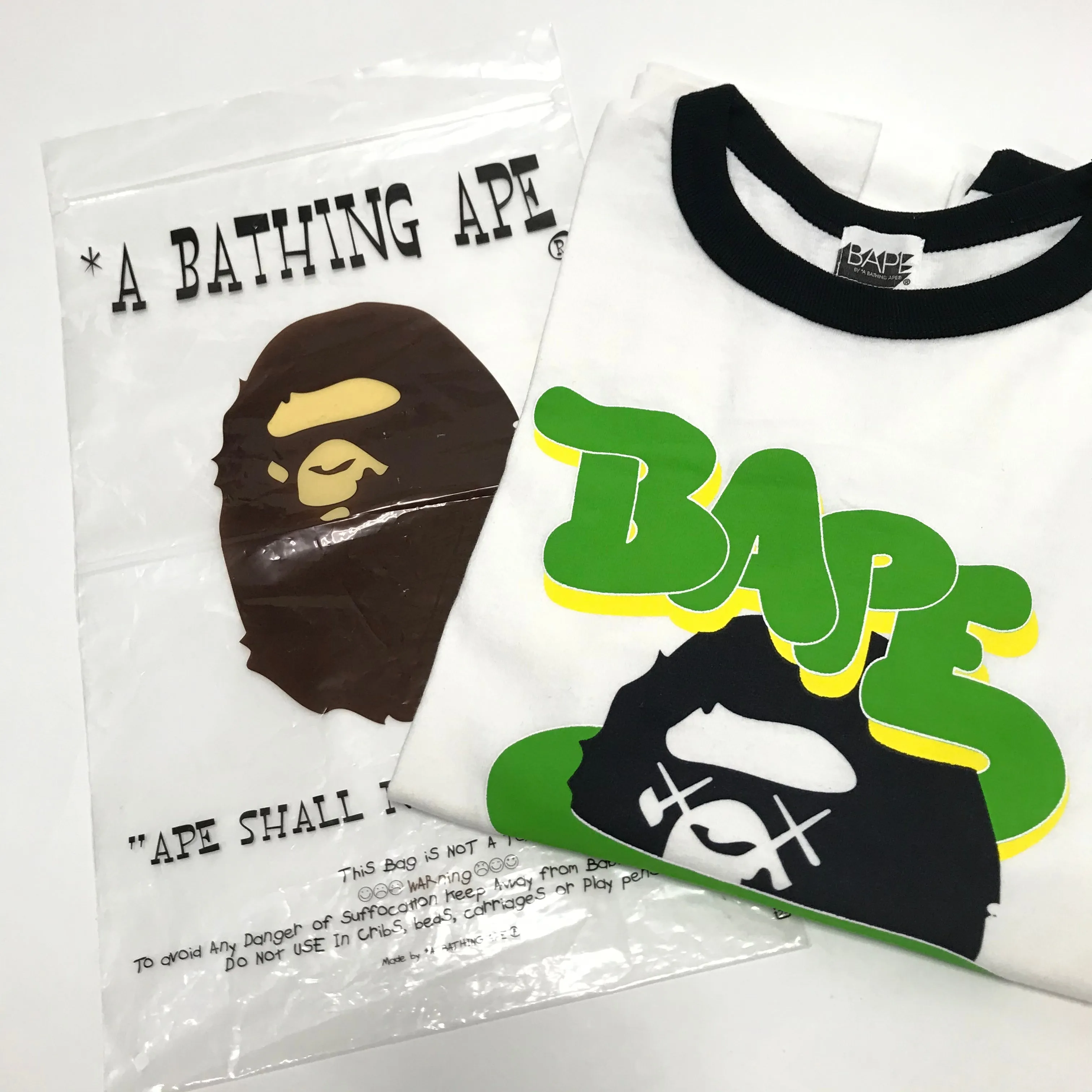 [S] A Bathing Ape Bape x Kaws Logo Ringer L/S Tee White