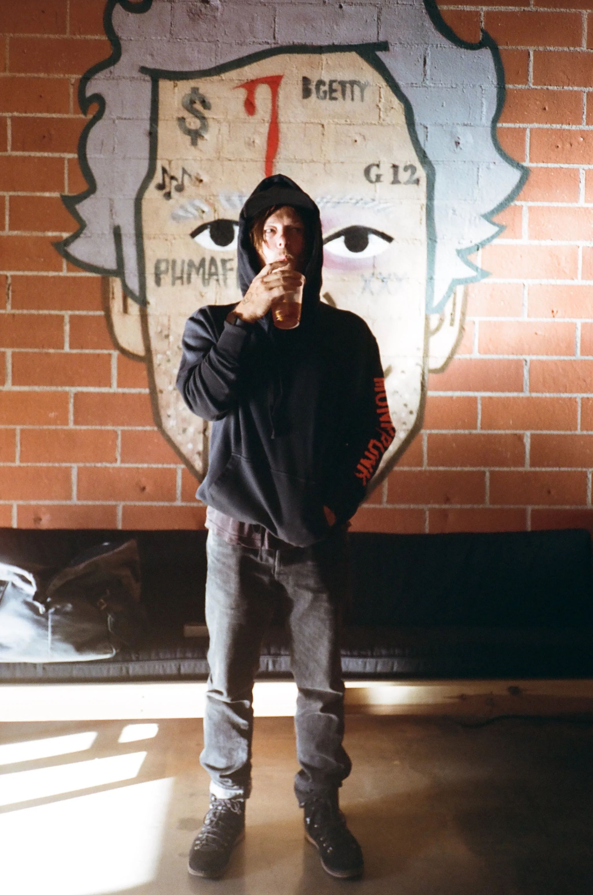 THE BLACK HOODIE (ORANGE LOGO)